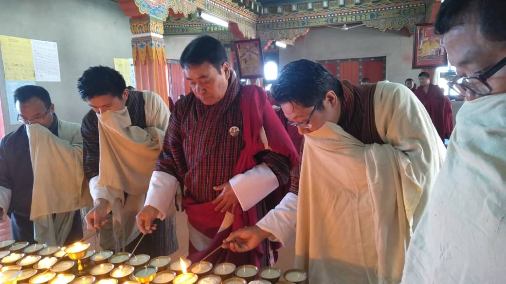 Lam Neten, Dasho Dzongda and sector heads offer prayers and butter lamps of His Majesty the King's long life and peaceful reign